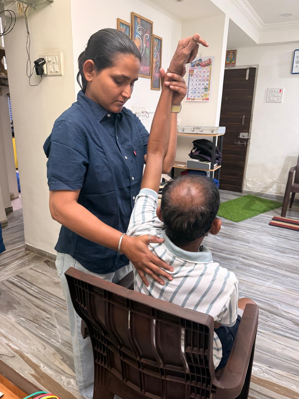 Shoulder mobilization and manual therapy session at Vasai clinic